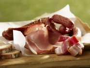 Closeup view of cold meat platter with smoked sausages — Stock Photo