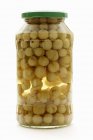 Preserved gooseberries in screw-top jar — Stock Photo