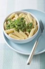 Penne pasta with basil pesto — Stock Photo