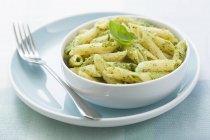 Penne pasta with basil pesto — Stock Photo