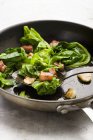Spring Cabbage with Bacon and garlic in frying pan — Stock Photo