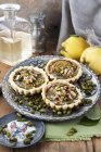 Elevated view of individual Quince tarts with pistachios and pine nuts — Stock Photo