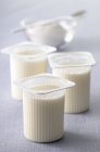 Natural yoghurt in pots — Stock Photo