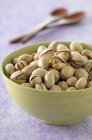 Toasted pistachios in bowl — Stock Photo