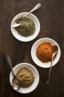 Top view of three different spices in white dishes — Stock Photo