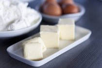 Closeup view of chunks of butter, quark and eggs — Stock Photo