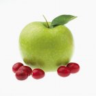 Cranberries and green apple — Stock Photo