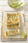 Bean quiche on wire rack with baking paper — Stock Photo