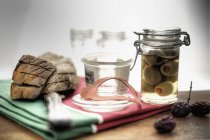 Pickled olives in pickling jar — Stock Photo