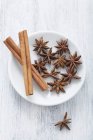 Cinnamon sticks on a plate — Stock Photo
