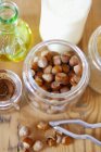 Hazelnuts spread in jar — Stock Photo
