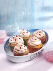 Cupcakes with fruit buttercream icing — Stock Photo
