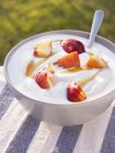 Natural yoghurt with peach — Stock Photo