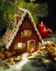 Gingerbread house with candles — Stock Photo