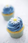 Cupcakes with blue buttercream icing — Stock Photo