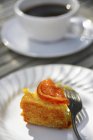 Orange cake with cup of coffee — Stock Photo