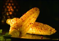 Corn with red peppercorns — Stock Photo