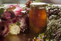 Jar of honey with honeycomb — Stock Photo