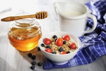 Muesli with berries and milk — Stock Photo