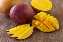 Whole with Sliced and Diced mangos — Stock Photo