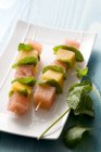 Closeup view of melon skewers with mint leaves — Stock Photo