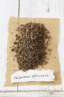 Top view of dried garden valerian on paper — Stock Photo
