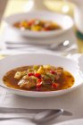 Fish stew with potatoes and peppers — Stock Photo