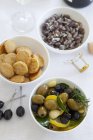 Olives, cheese crackers — Stock Photo