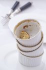 Closeup view of empty souffle dishes in a pile — Stock Photo