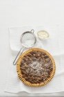 Pecan pie with icing sugar — Stock Photo