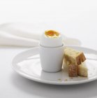 Boiled egg in stand — Stock Photo