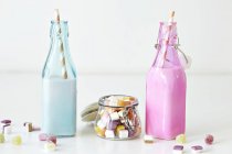 Strawberry shakes in two bottles — Stock Photo