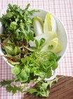 Fresh lettuce in colander — Stock Photo