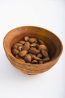 Almonds in wooden dish — Stock Photo