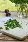 Chopped parsley with mezzaluna — Stock Photo