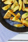 Roasted rosemary potato wedges — Stock Photo