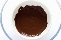 Bowl of melted chocolate — Stock Photo