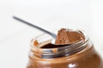 Chocolate spread on spoon — Stock Photo