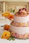 Cake with candied rose petals — Stock Photo