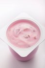 Fruit yoghurt in pot — Stock Photo