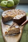 Apple cake with slice removed — Stock Photo