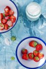 Fresh strawberries in bowls — Stock Photo