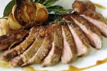 Sliced roasted beef steak — Stock Photo