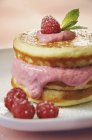 Pancakes with raspberry and yoghurt cream — Stock Photo