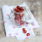 Wild strawberries in preserving jar — Stock Photo