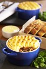 Cottage pie with bread — Stock Photo