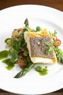 Halibut fillet with asparagus — Stock Photo