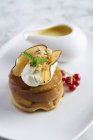 Closeup view of apple Timbale with maple syrup — Stock Photo