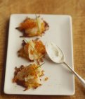 Mini potato fritters with smoked salmon — Stock Photo