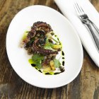 Grilled octopus with pickled eggplant — Stock Photo